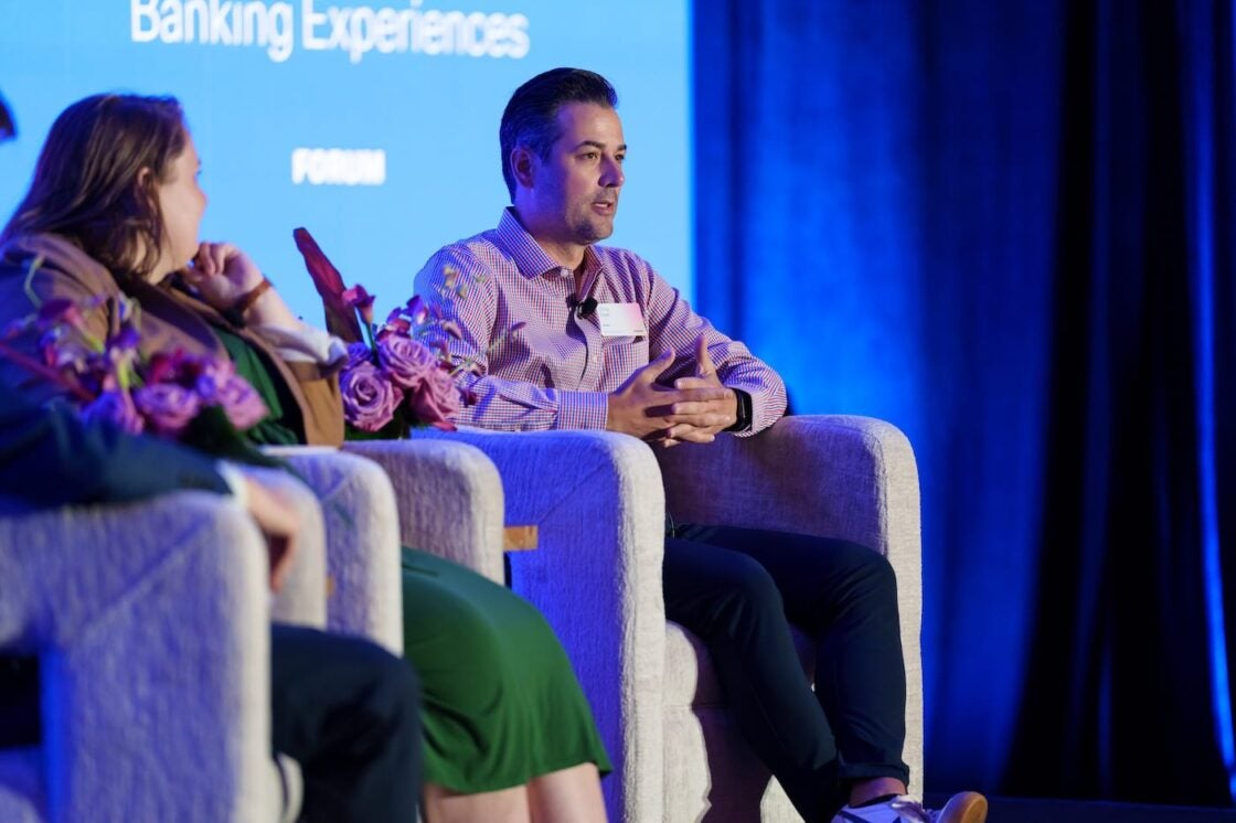 Speakers on stage for "Designing Application-less, Hyper-Personalized Banking Experiences" breakout session.