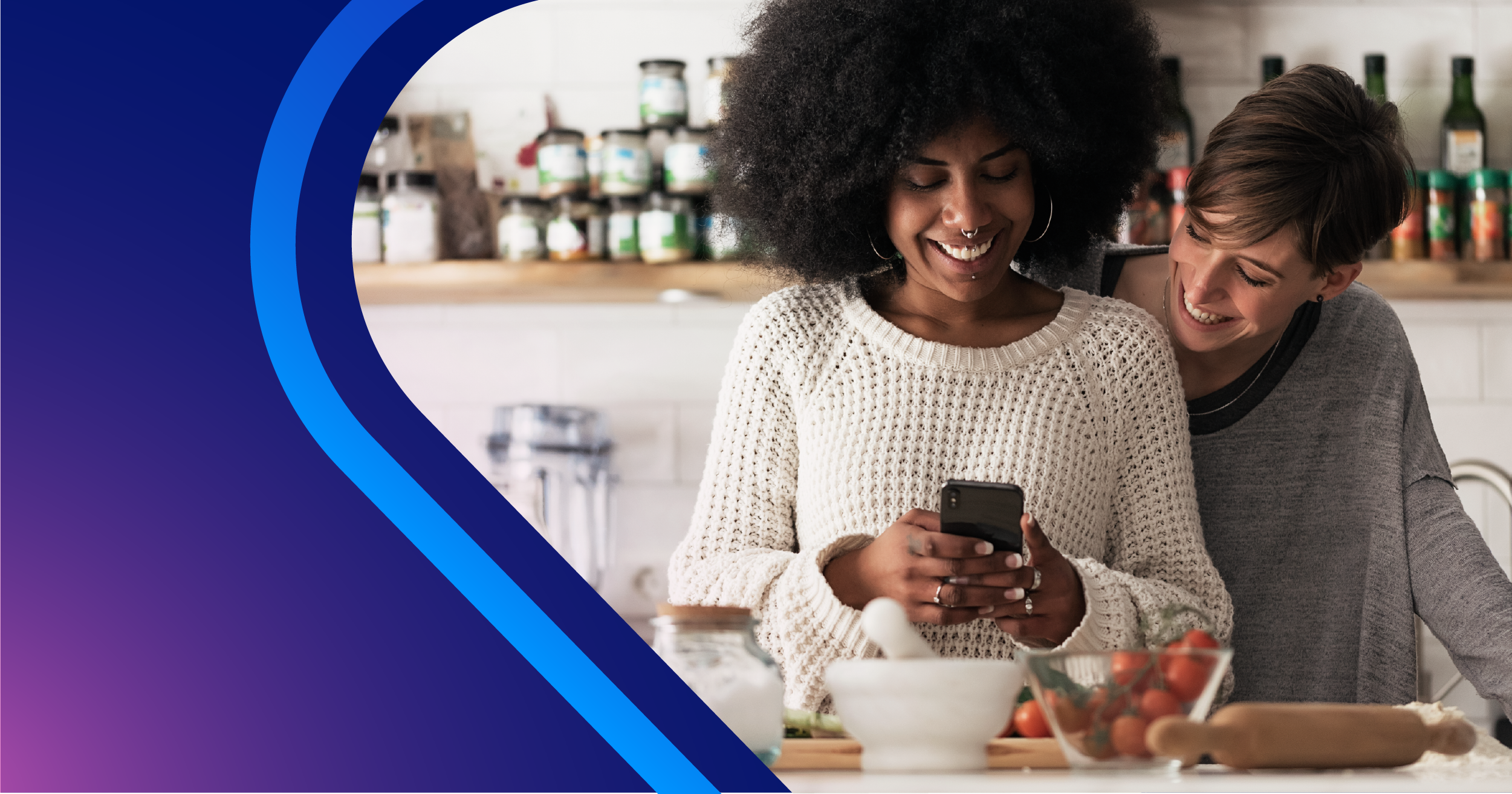 Blue and purple gradient on left side with two woman standing next to each other in kitchen on the right side