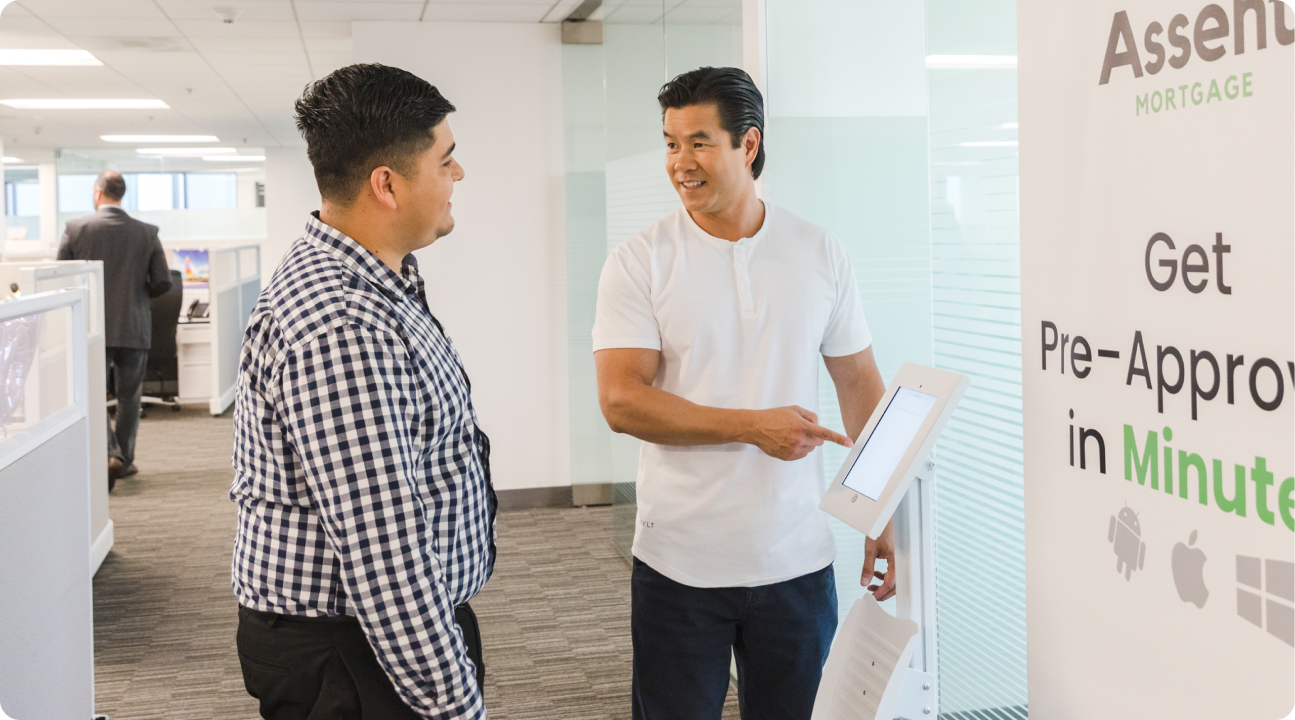 Image of two men in front of white board