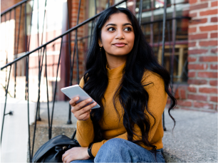 Girl on her phone on steps outside